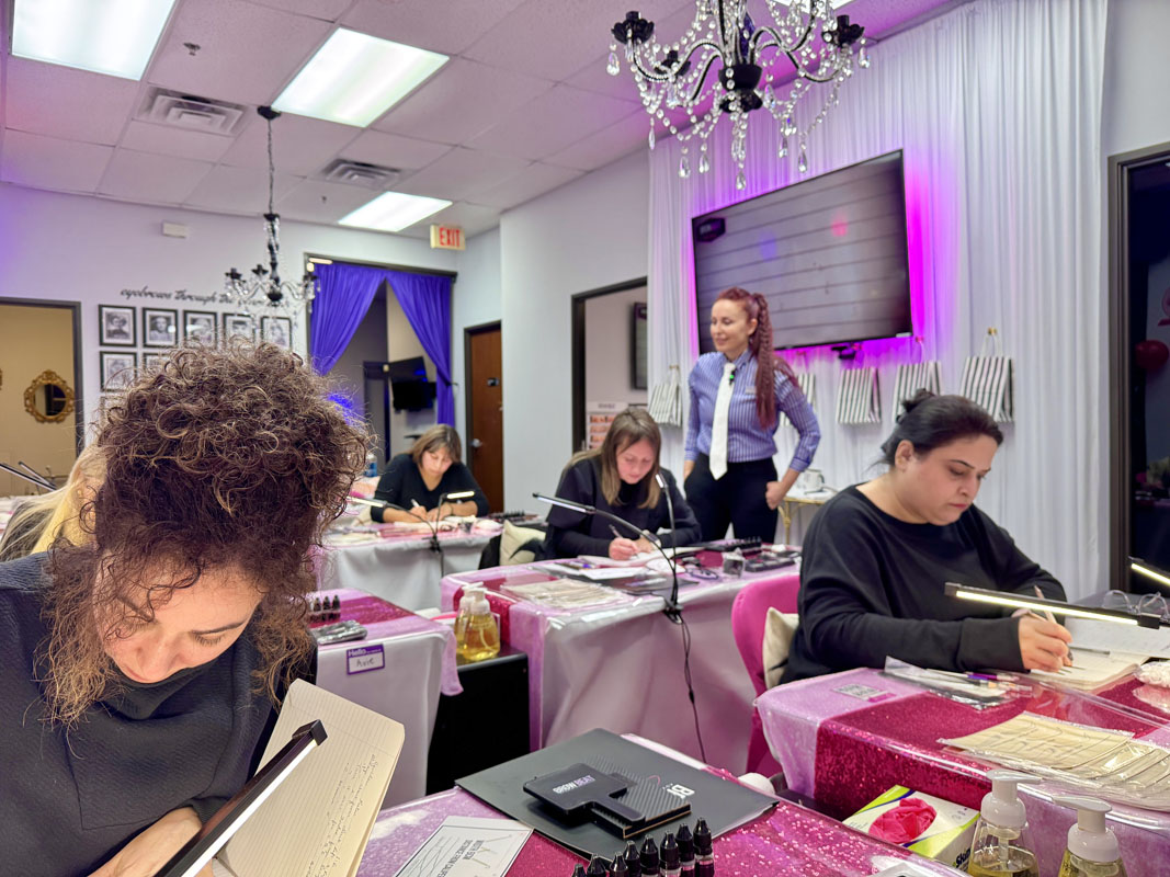 Business solutions lecture during Texas microblading training