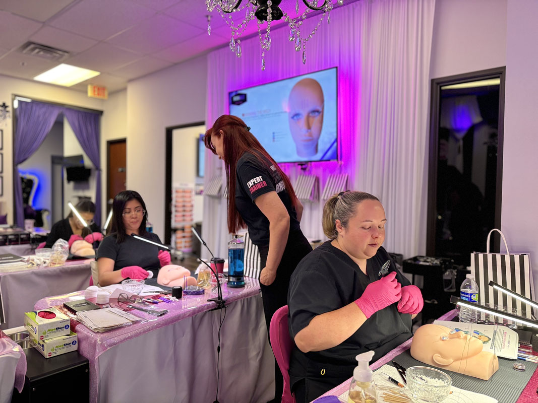 Student mapping brows on mannequin head during certification