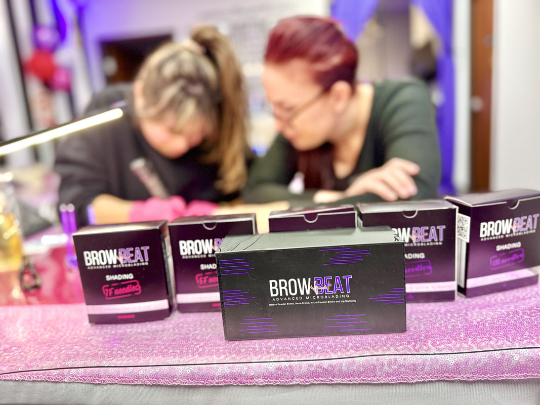 Student using cartridges for brow shading in Dallas class Training with 1R, 3R, 5R, and 5F cartridges in classroom practice