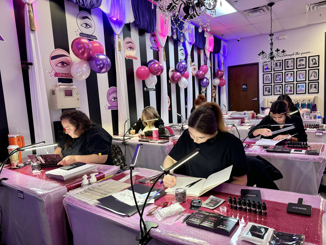 Workbook with handwritten notes during brow training