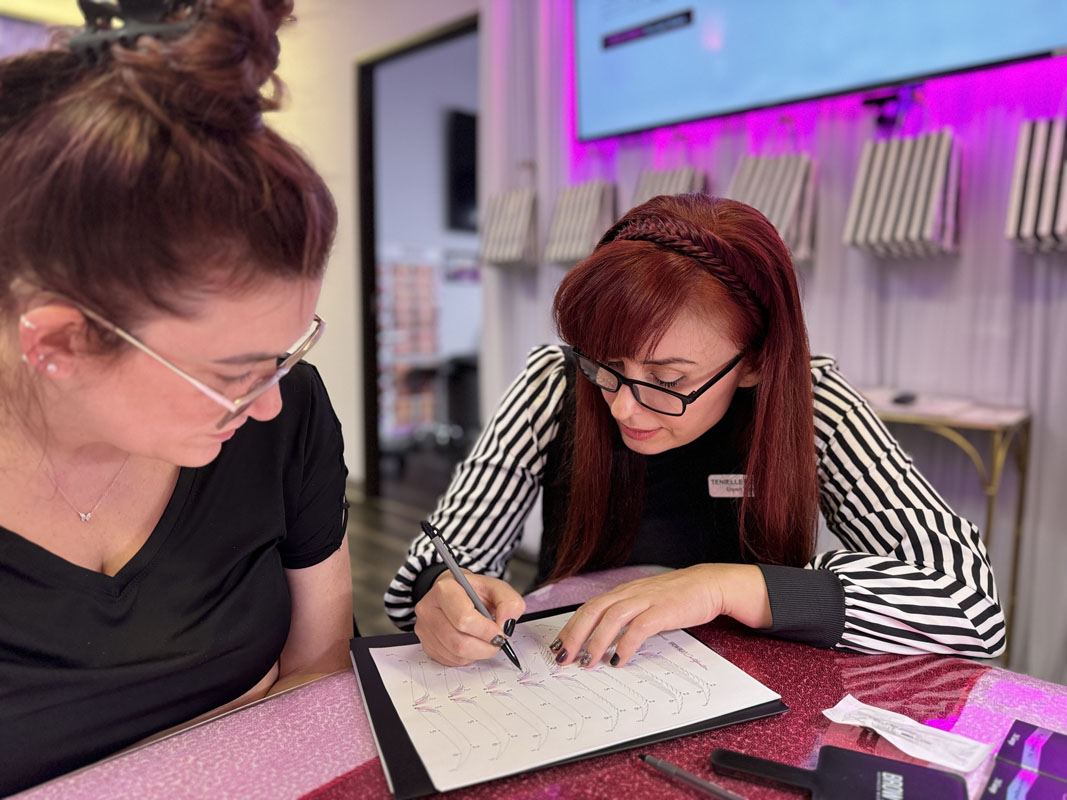 Paper exercise for repeated microblading strokes in training course Student repeating hair strokes on lined paper sheet